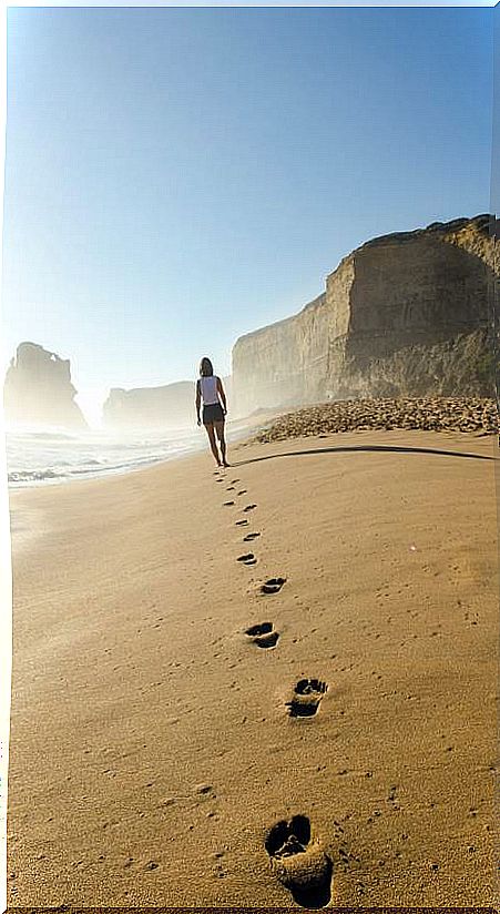 Woman walking on the beach