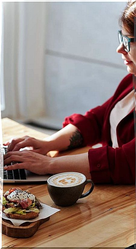 Woman eating in office